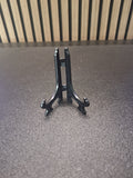 Black 3 inch display stand holding a darts keyring front view