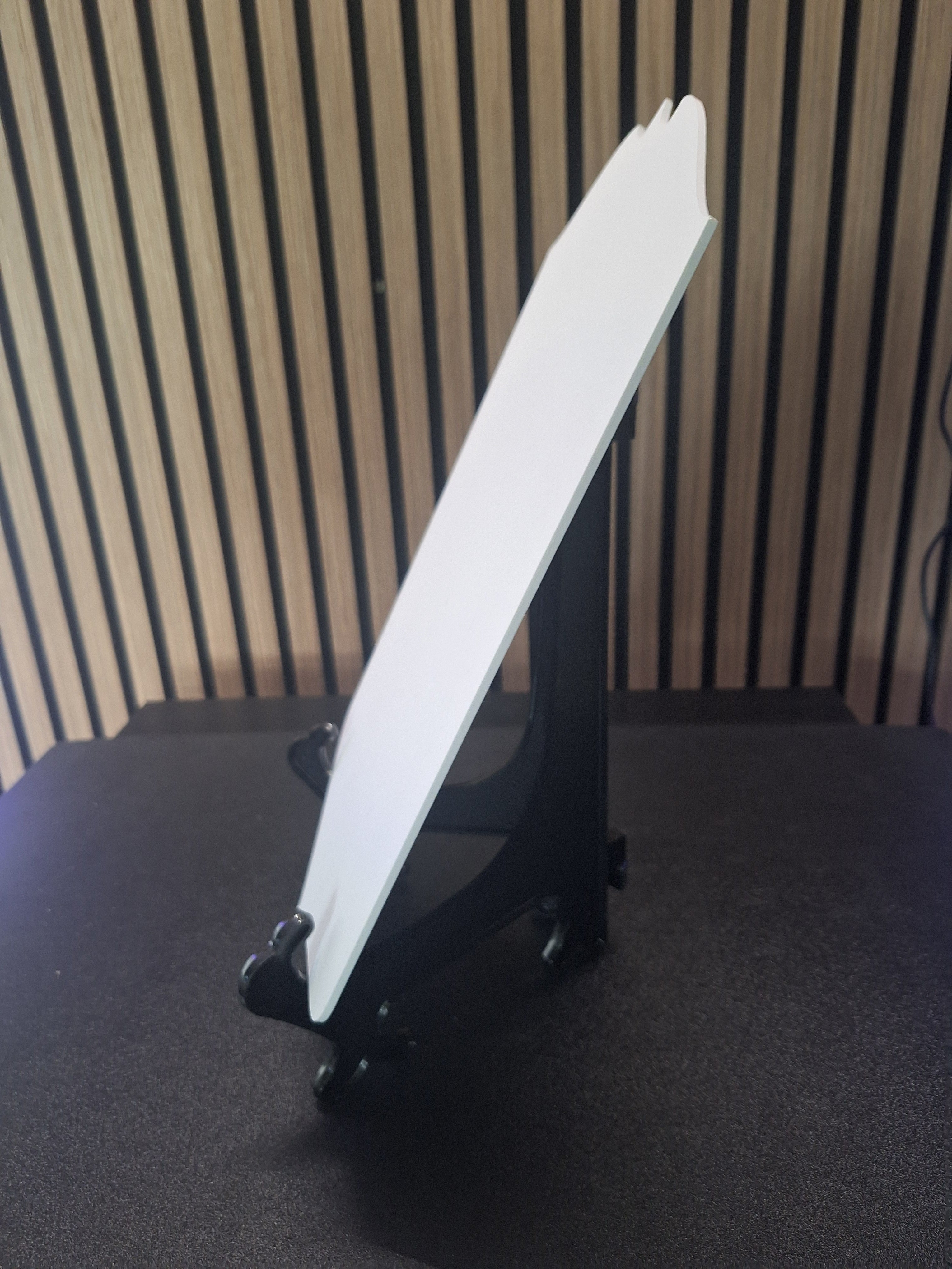 Side view of player card display stand showing angle and support with card